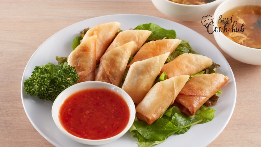 Bestcookhub - Perfectly cooked golden brown egg rolls with sweet chili sauce