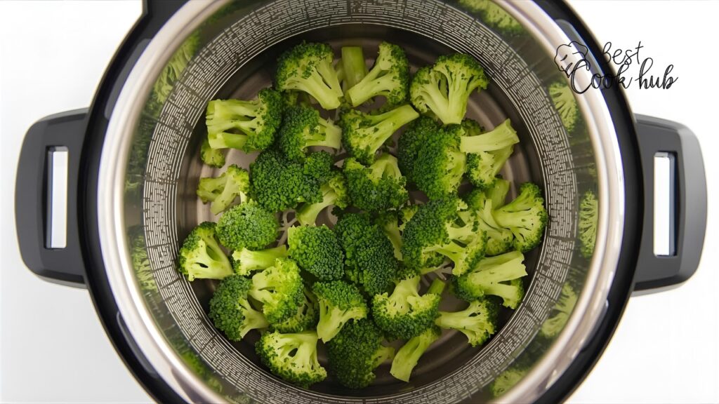 Bestcookhub - Raw broccoli florets in Instant Pot steamer basket